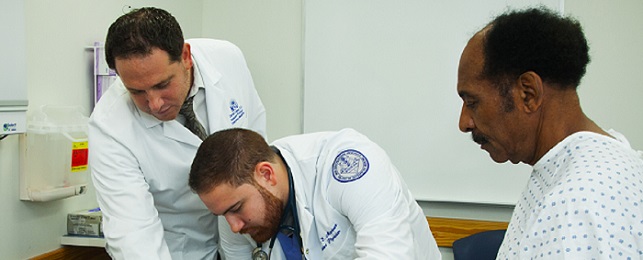 Dr. Darren Cohen demonstrates a patient examination to osteopathic medical student