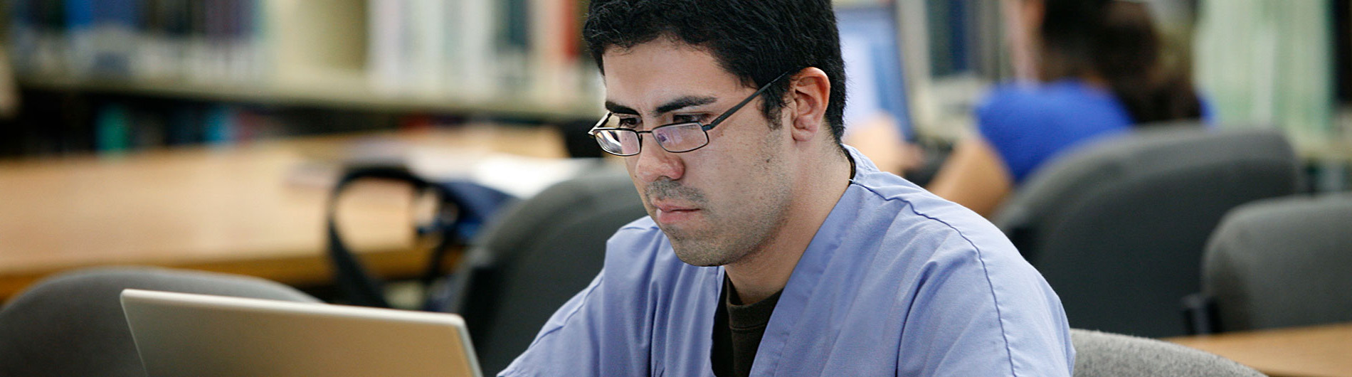 student studying in library