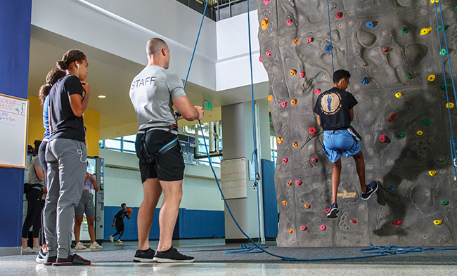 Students rock climbing in the gym
