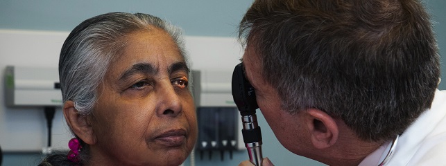 Dr. Penzell examines patient eyes